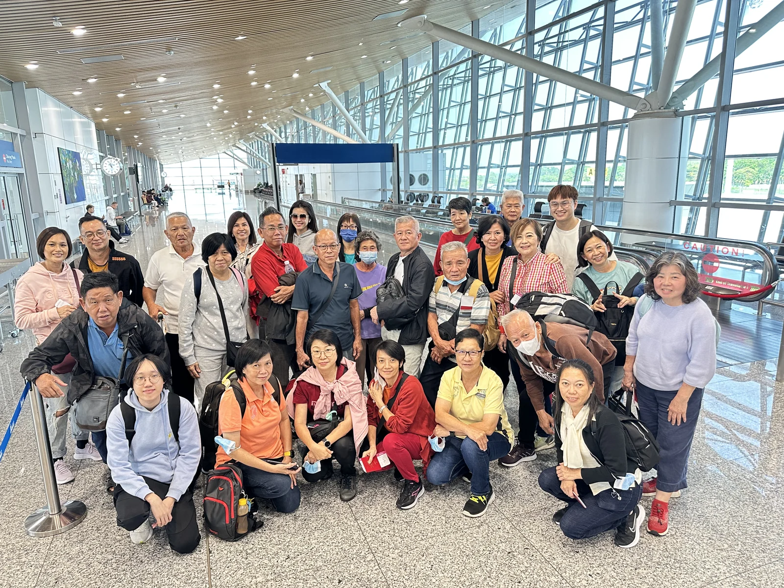 Our travel group gathering at the airport