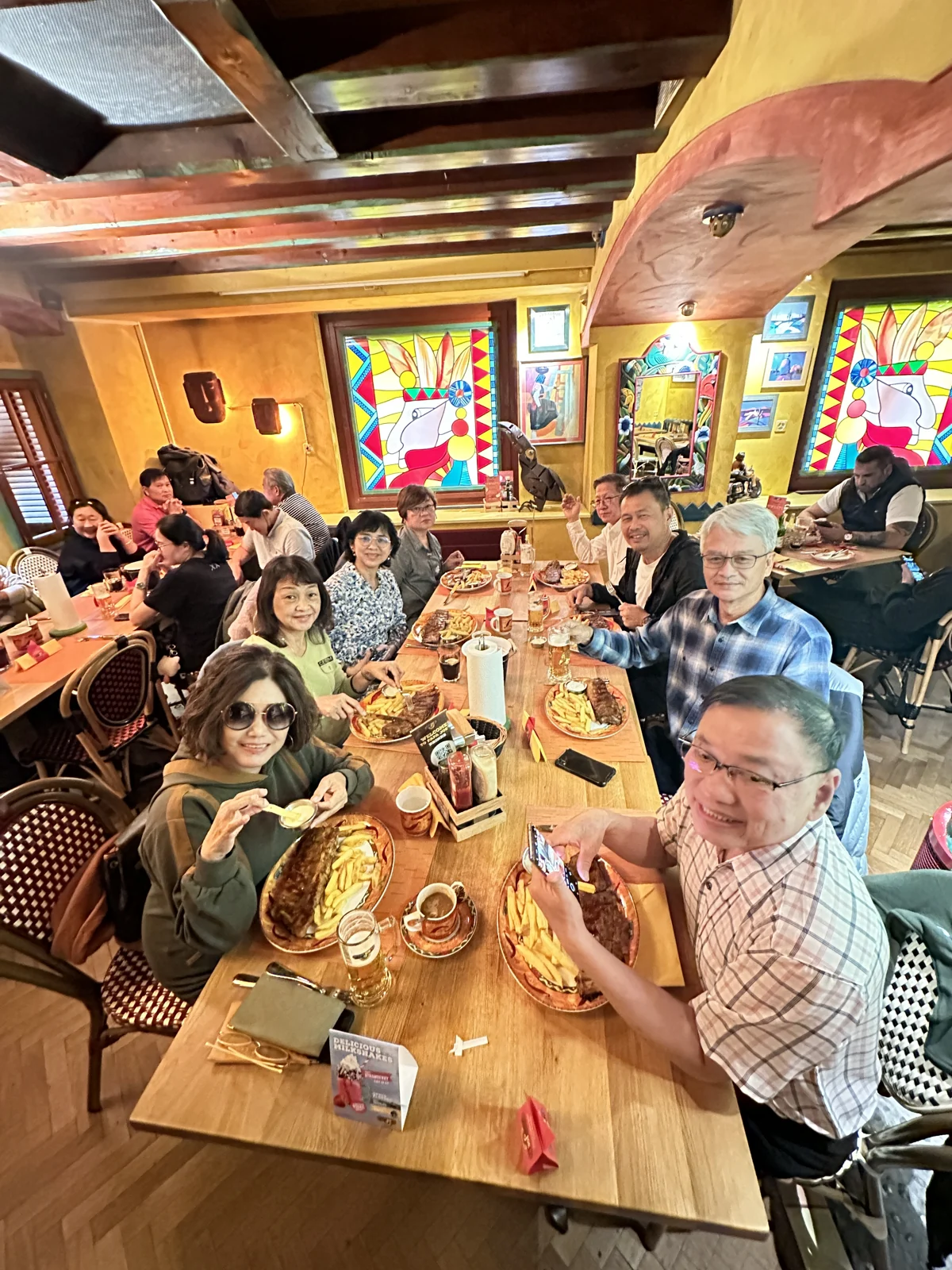 Our travel group sharing a meal in Switzerland