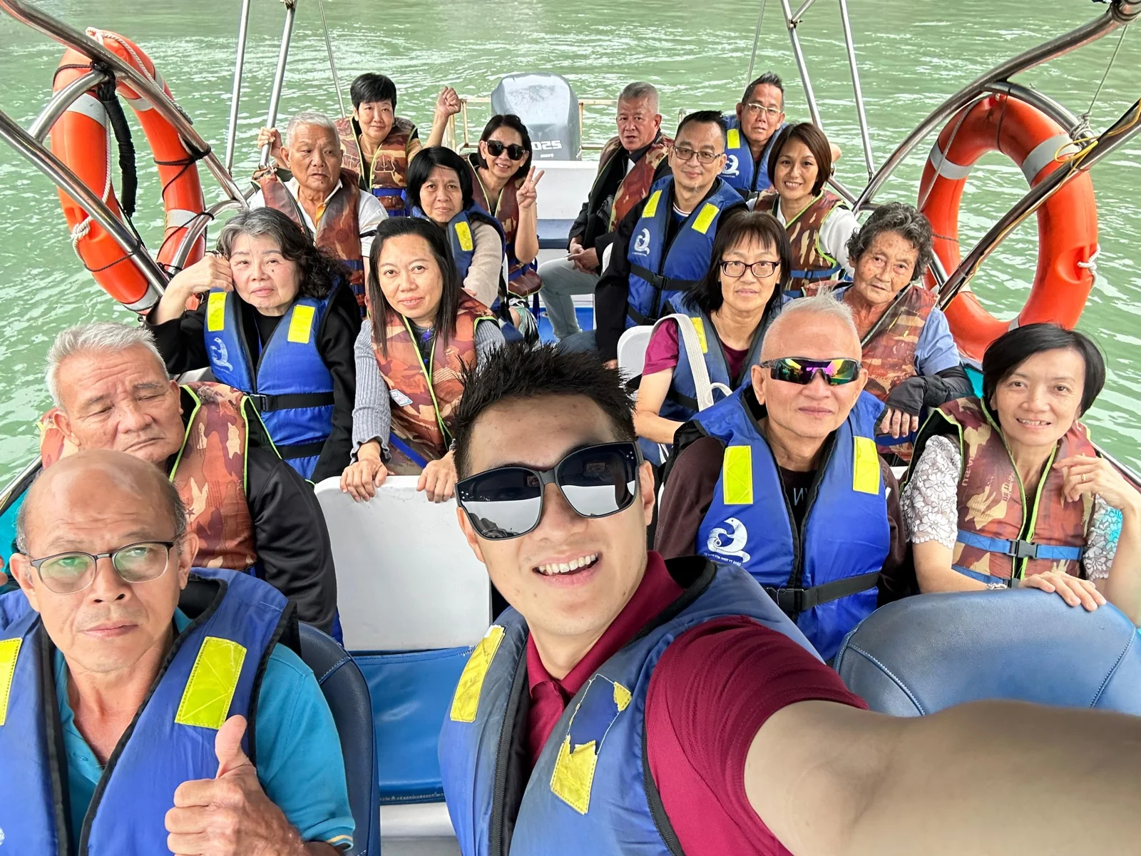 Travellers posing together on a boat