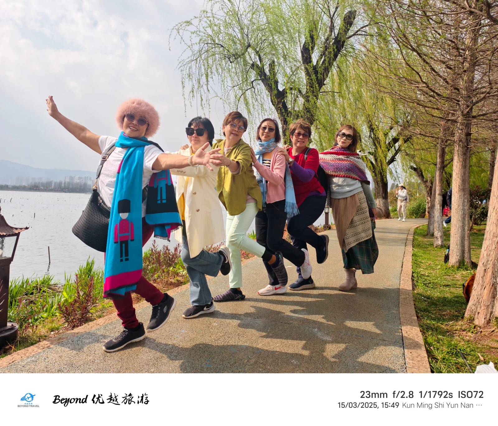 Travellers enjoying time together beside a lake