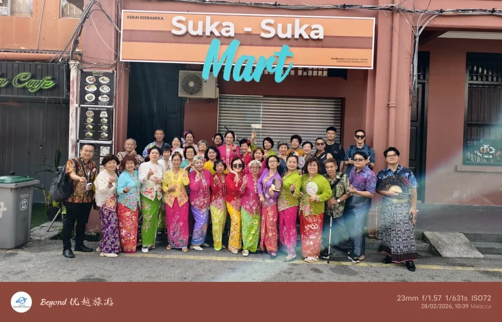 Travellers posing in local traditional clothing