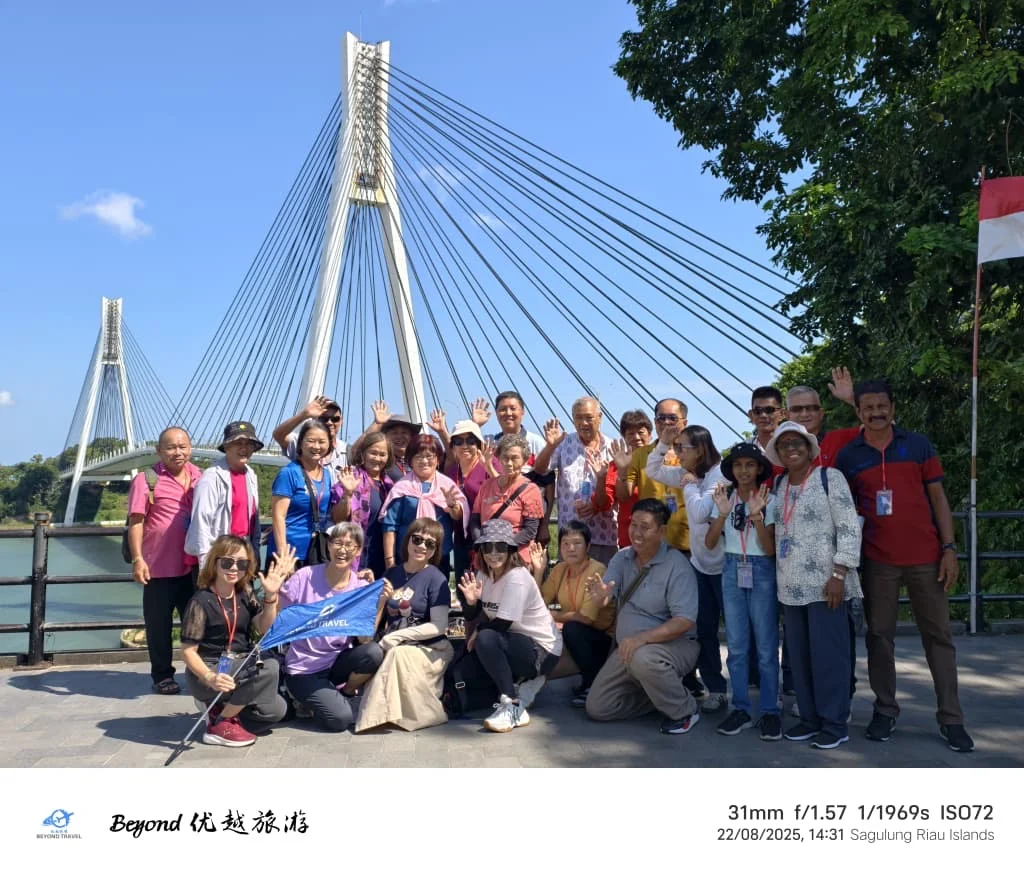 Travellers posing together beside a bridge