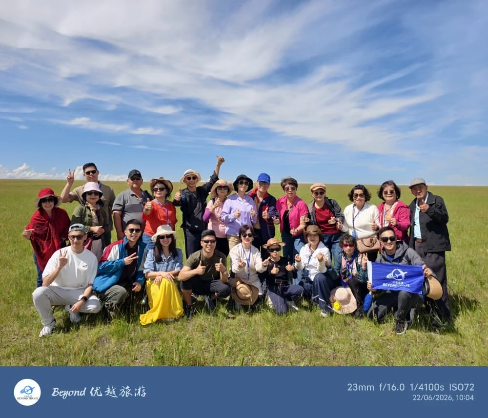 Travellers posing together on the grasslands
