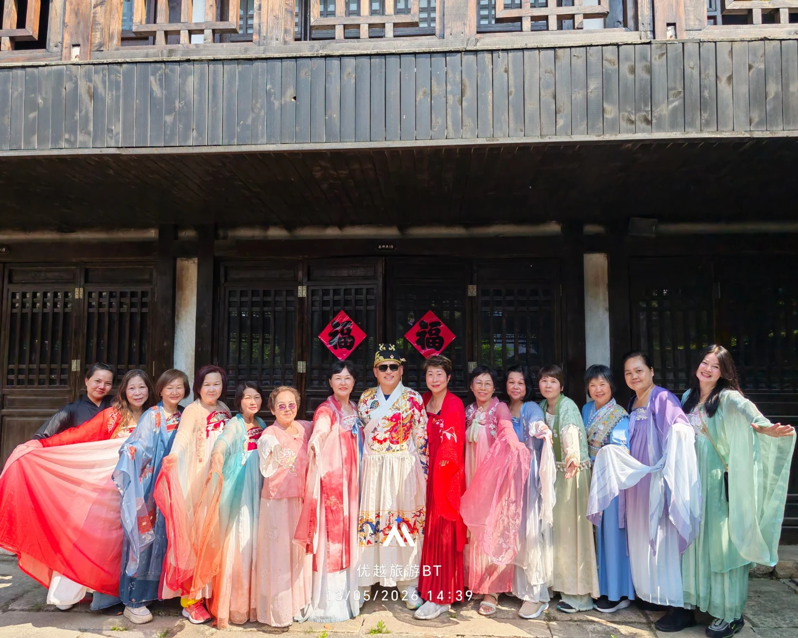 Travellers trying on traditional costumes
